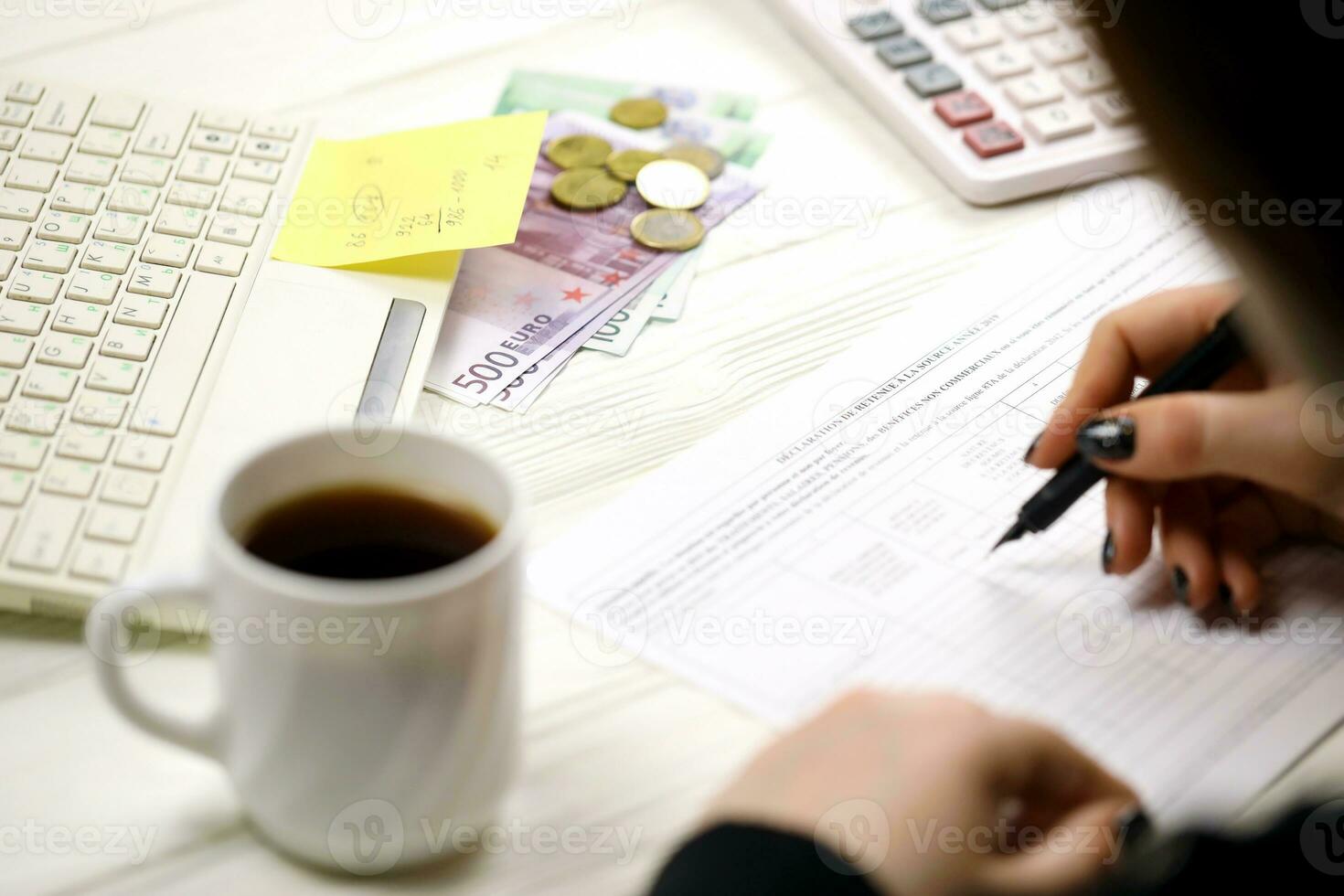 Accountant fill french tax form 2041E Withholding tax declaration in end of tax period. Taxation and paperwork routine photo
