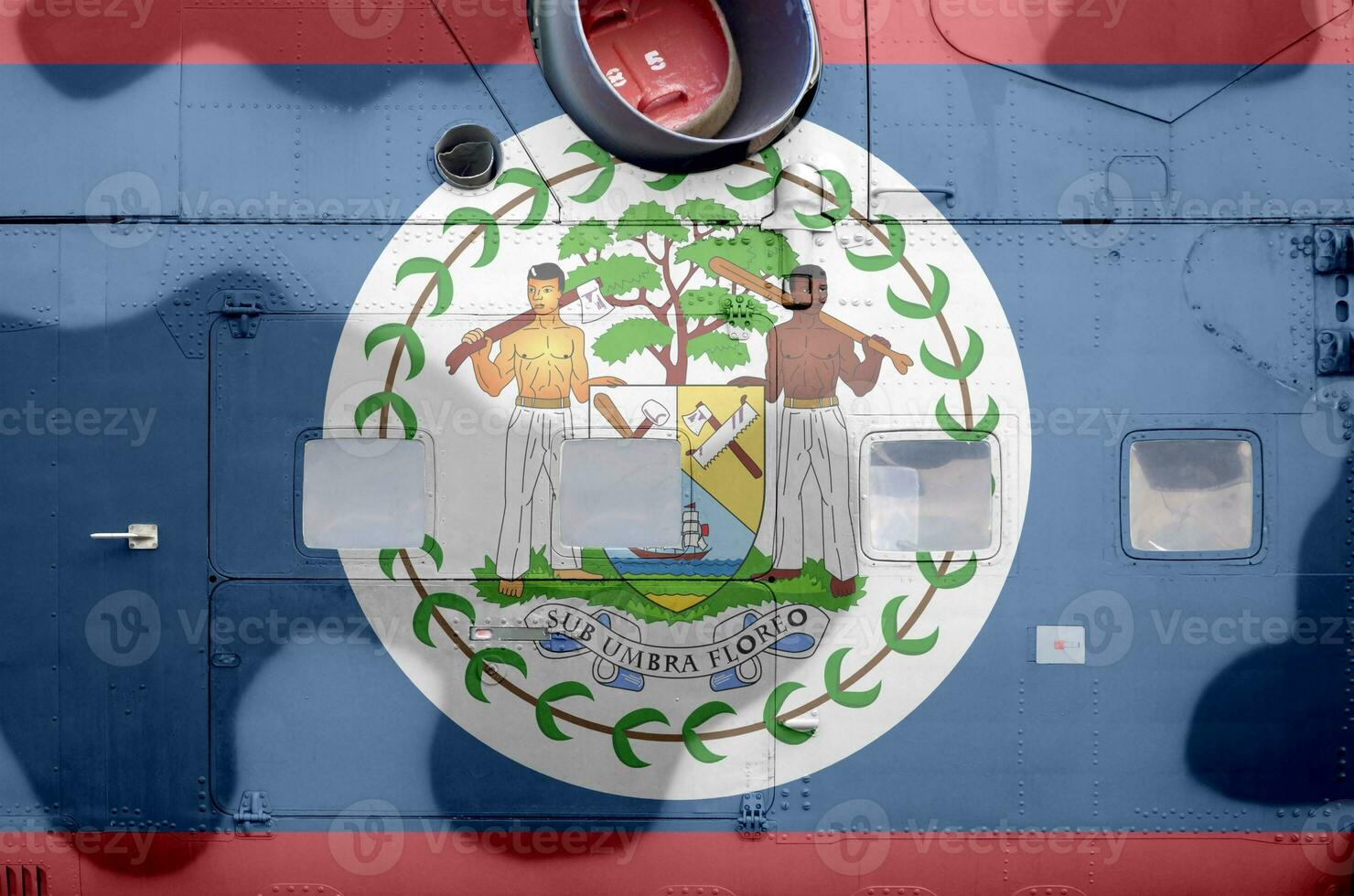 Belize flag depicted on side part of military armored helicopter closeup. Army forces aircraft conceptual background photo