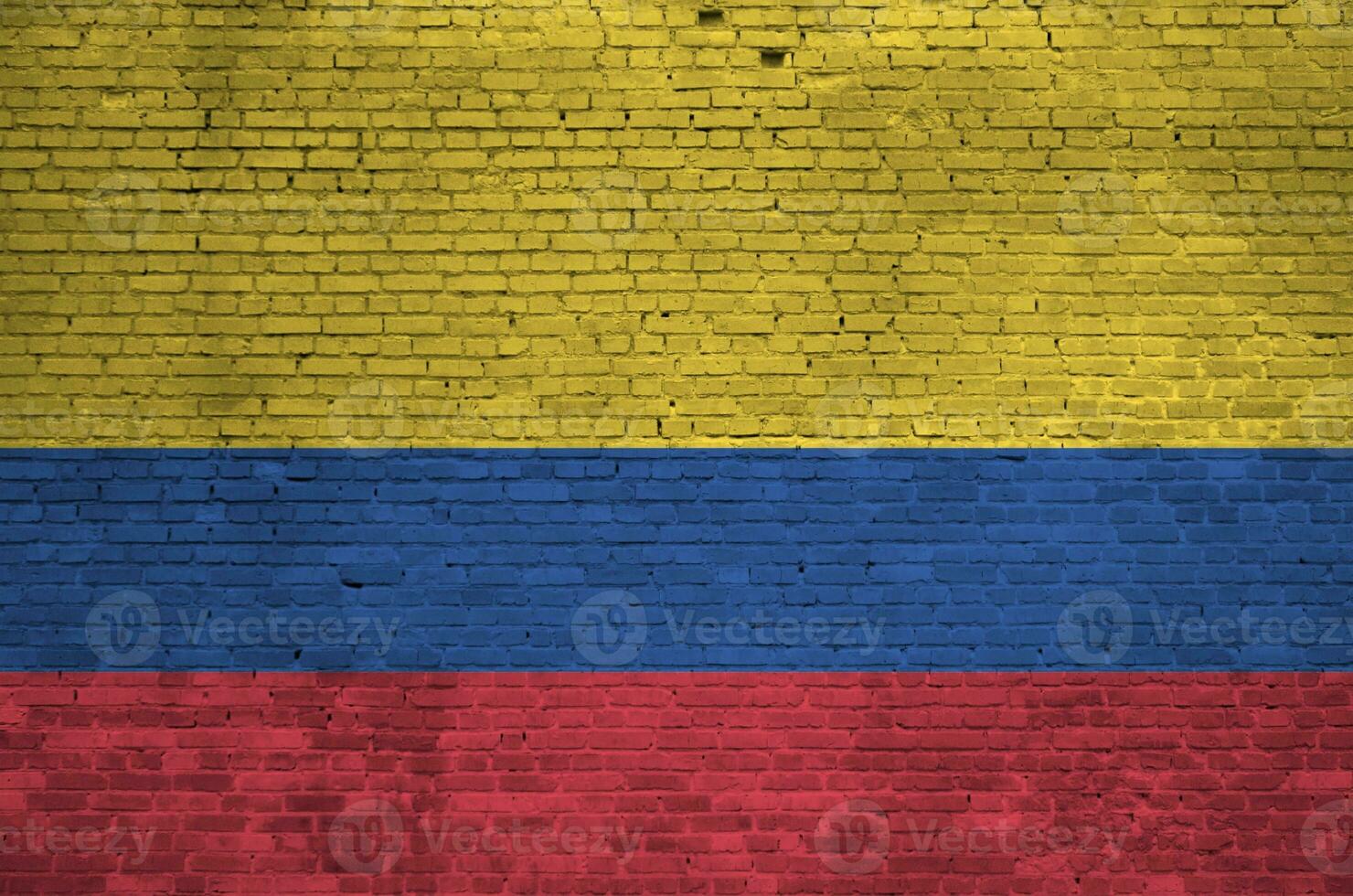 Colombia flag depicted in paint colors on old brick wall. Textured banner on big brick wall masonry background photo