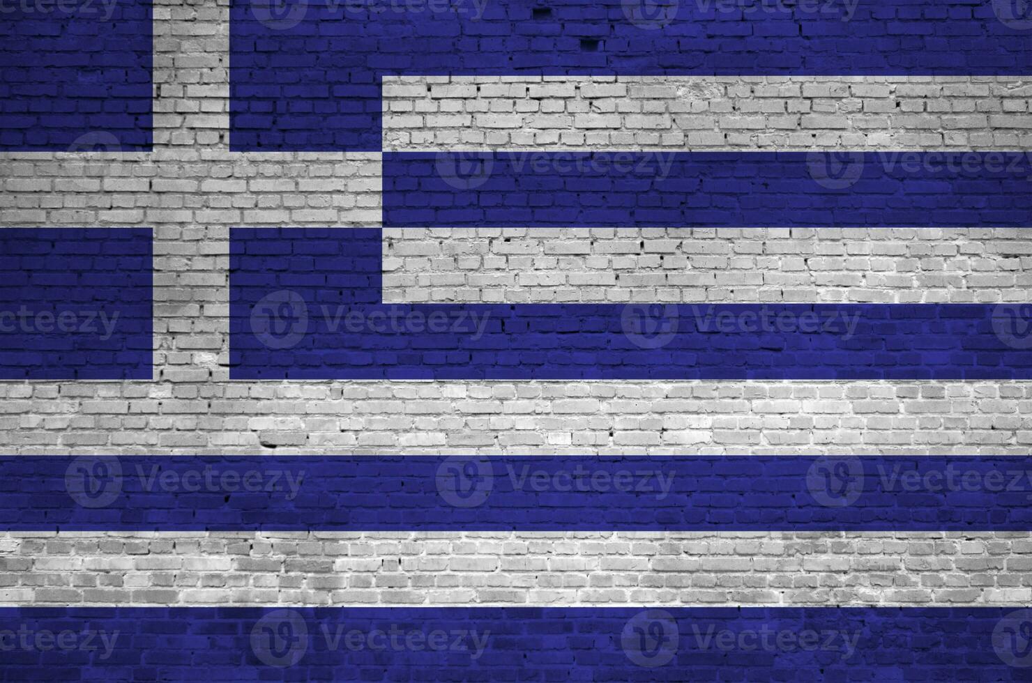 Greece flag depicted in paint colors on old brick wall. Textured banner on big brick wall masonry background photo