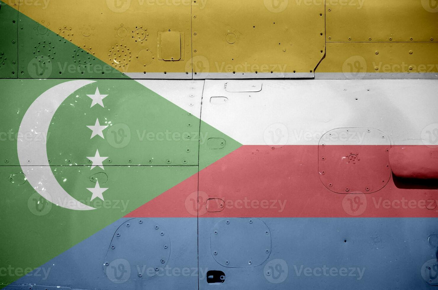 Comoros flag depicted on side part of military armored helicopter closeup. Army forces aircraft conceptual background photo