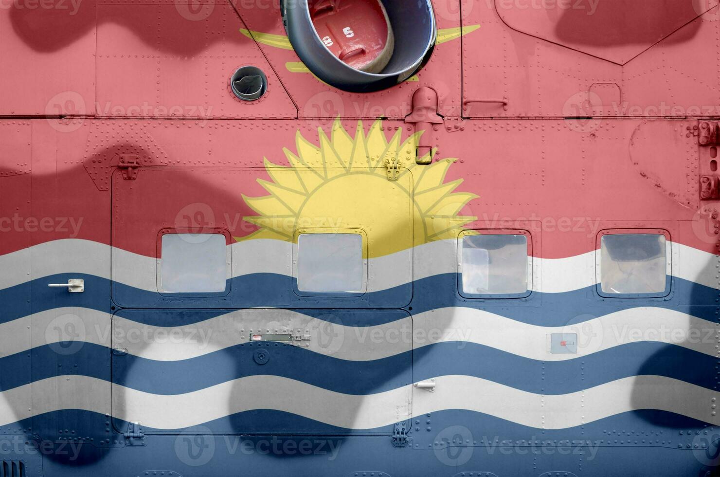 Kiribati flag depicted on side part of military armored helicopter closeup. Army forces aircraft conceptual background photo