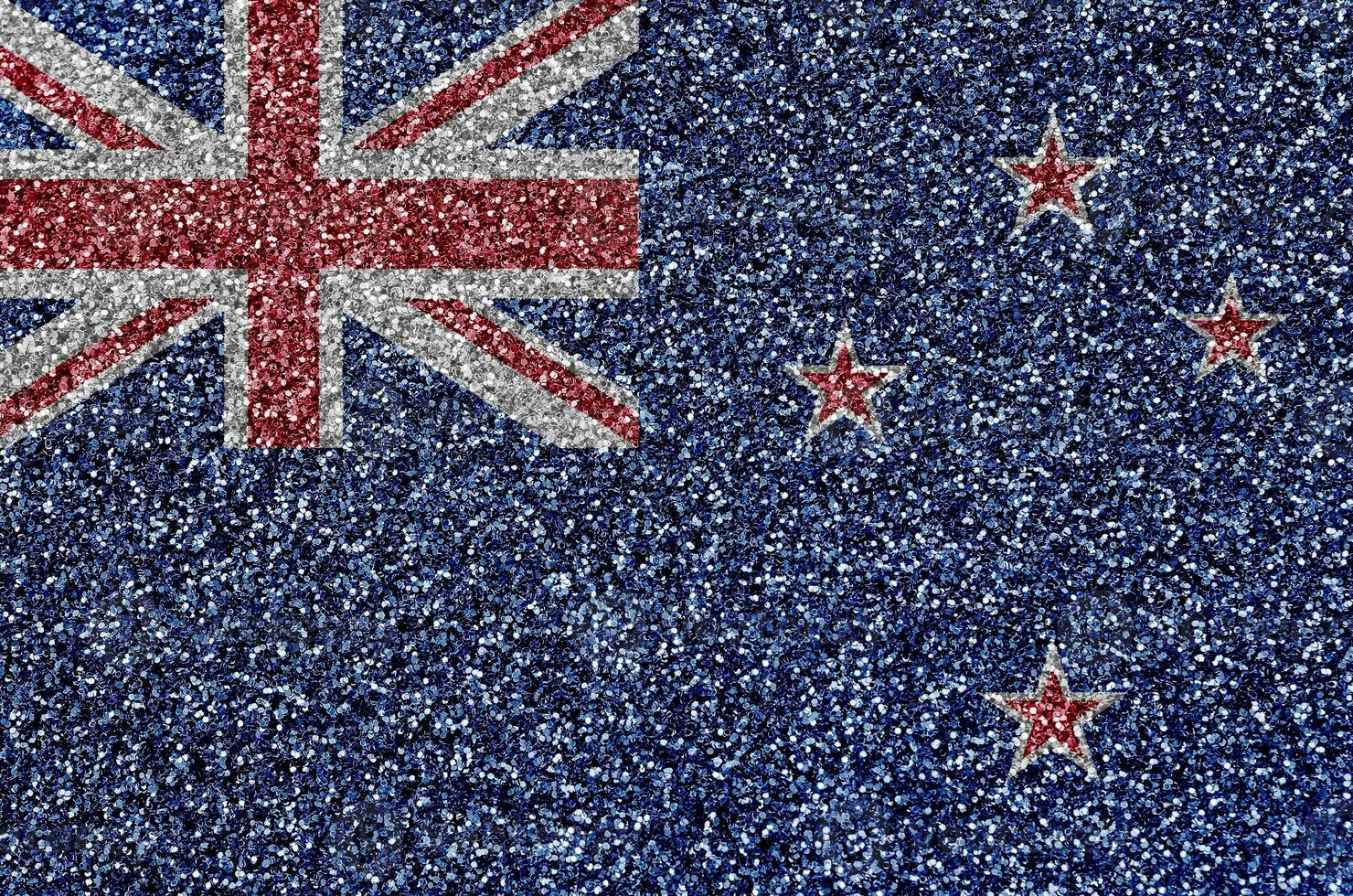 New Zealand flag depicted on many small shiny sequins. Colorful festival background for party photo