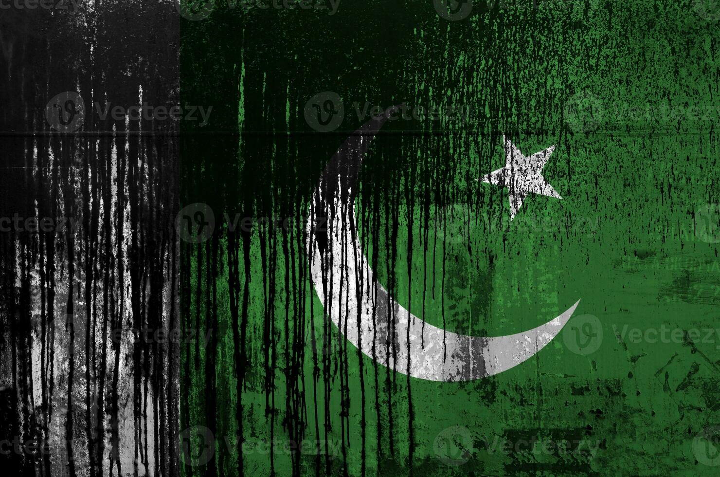 Pakistan flag depicted in paint colors on old and dirty oil barrel wall closeup. Textured banner on rough background photo