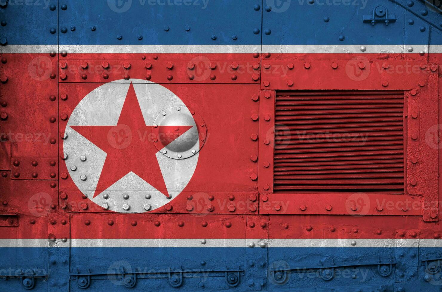North Korea flag depicted on side part of military armored tank closeup. Army forces conceptual background photo