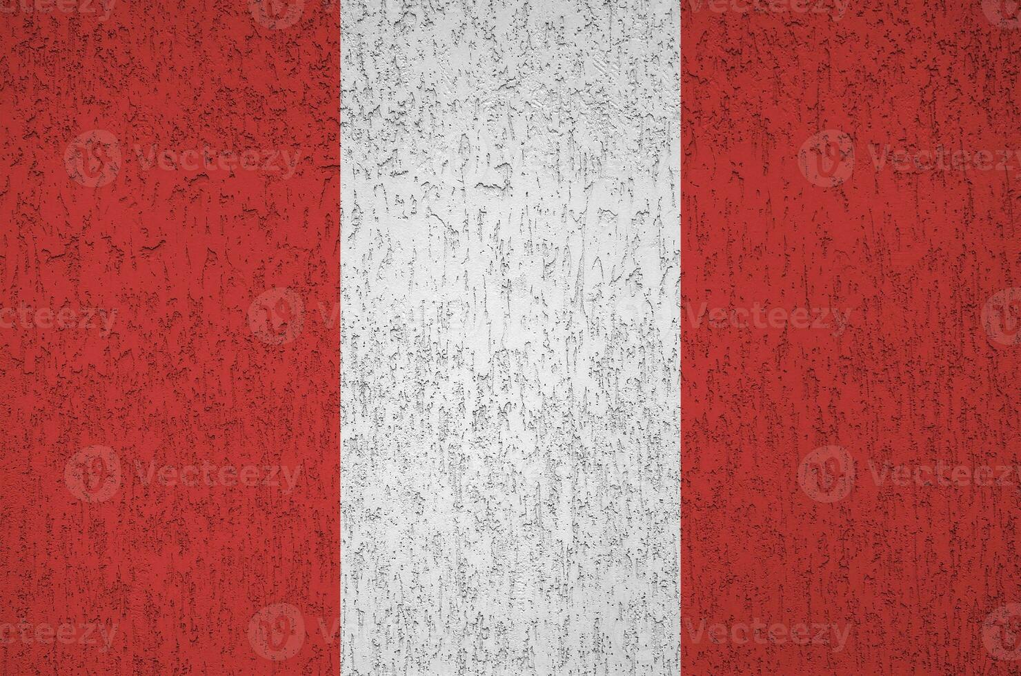 Peru flag depicted in bright paint colors on old relief plastering wall. Textured banner on rough background photo