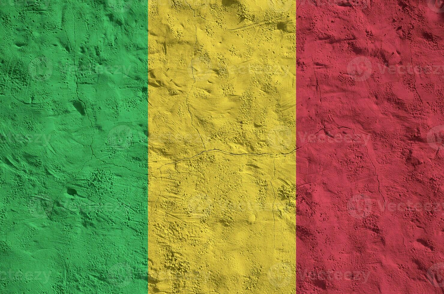 Mali flag depicted in bright paint colors on old relief plastering wall. Textured banner on rough background photo