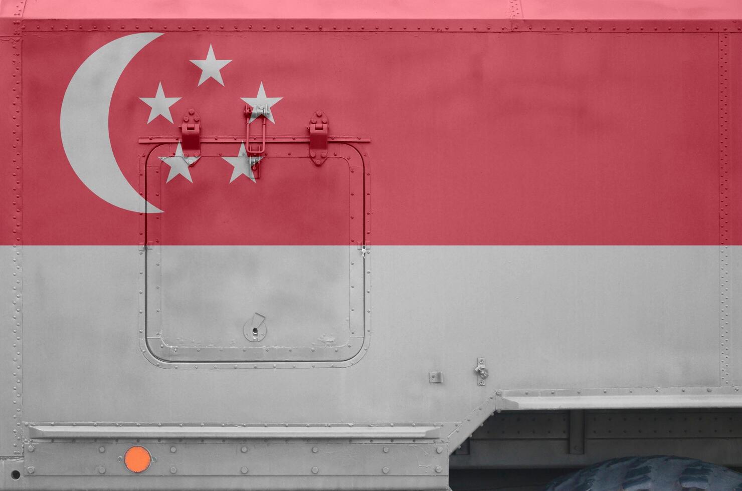 Singapore flag depicted on side part of military armored truck closeup. Army forces conceptual background photo