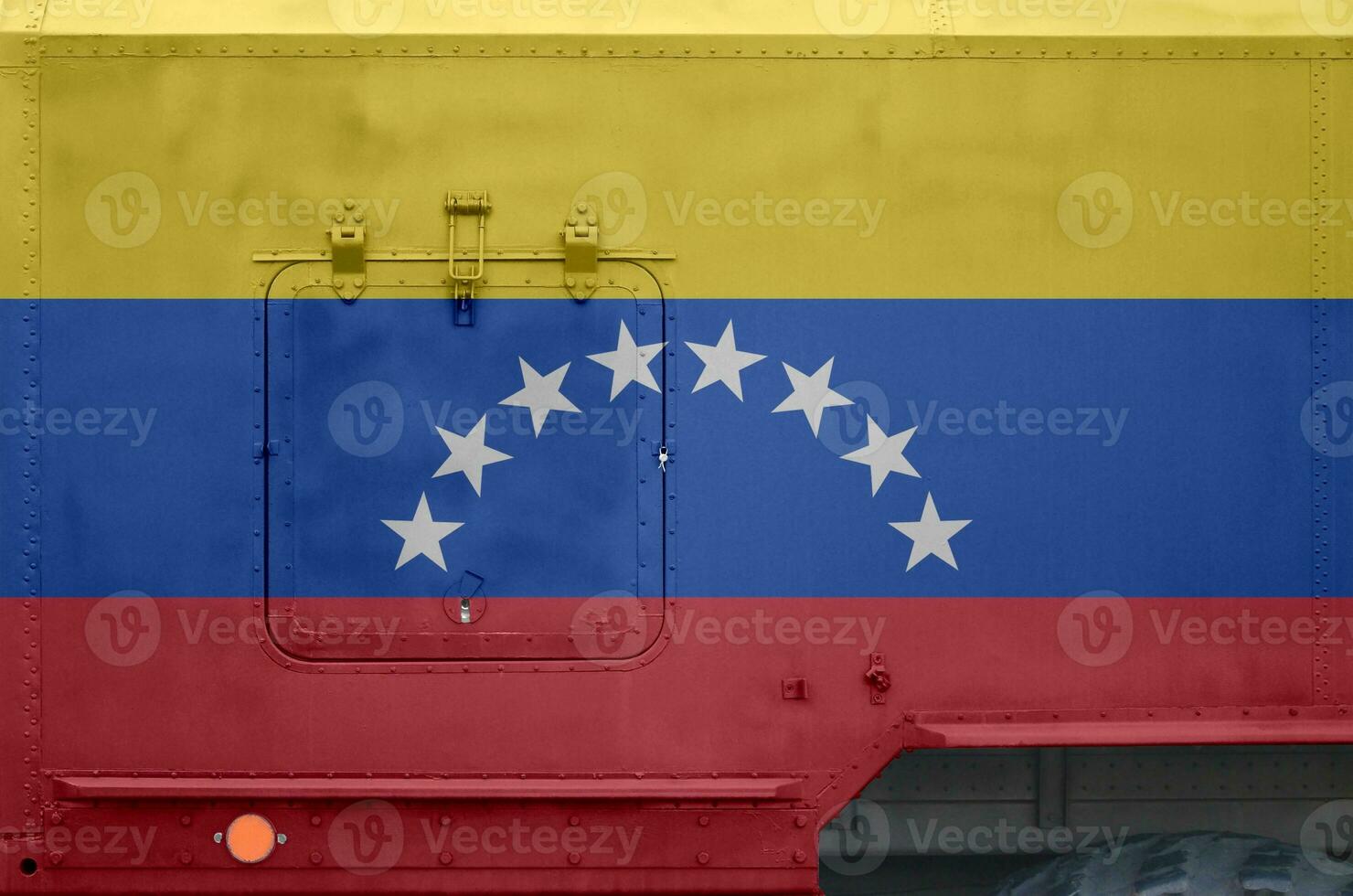 Venezuela flag depicted on side part of military armored truck closeup. Army forces conceptual background photo