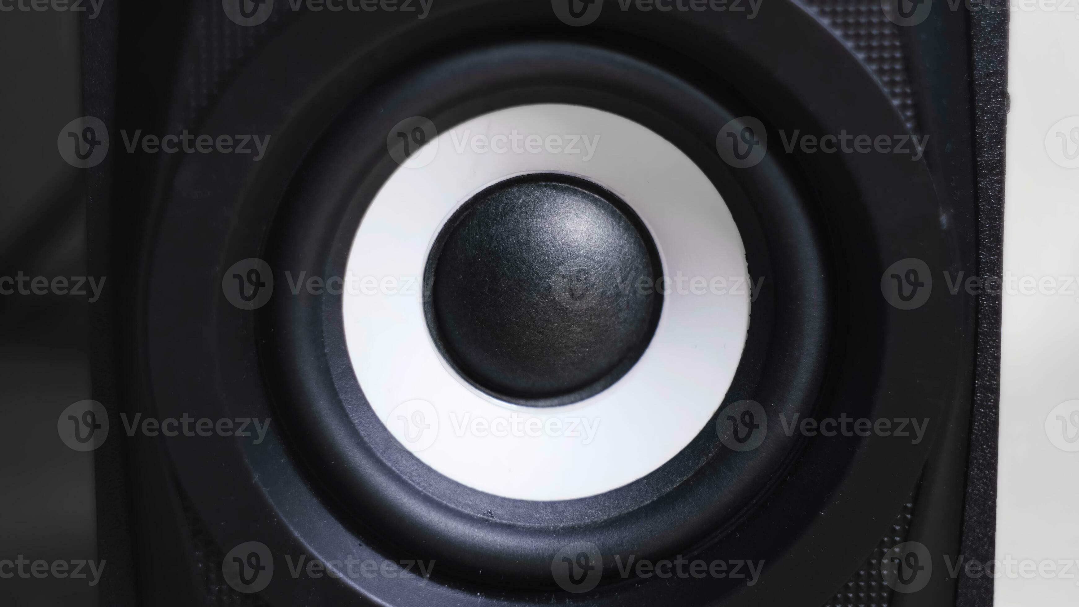 Closeup of vibrating bass speaker. Concept. Black speaker vibrates