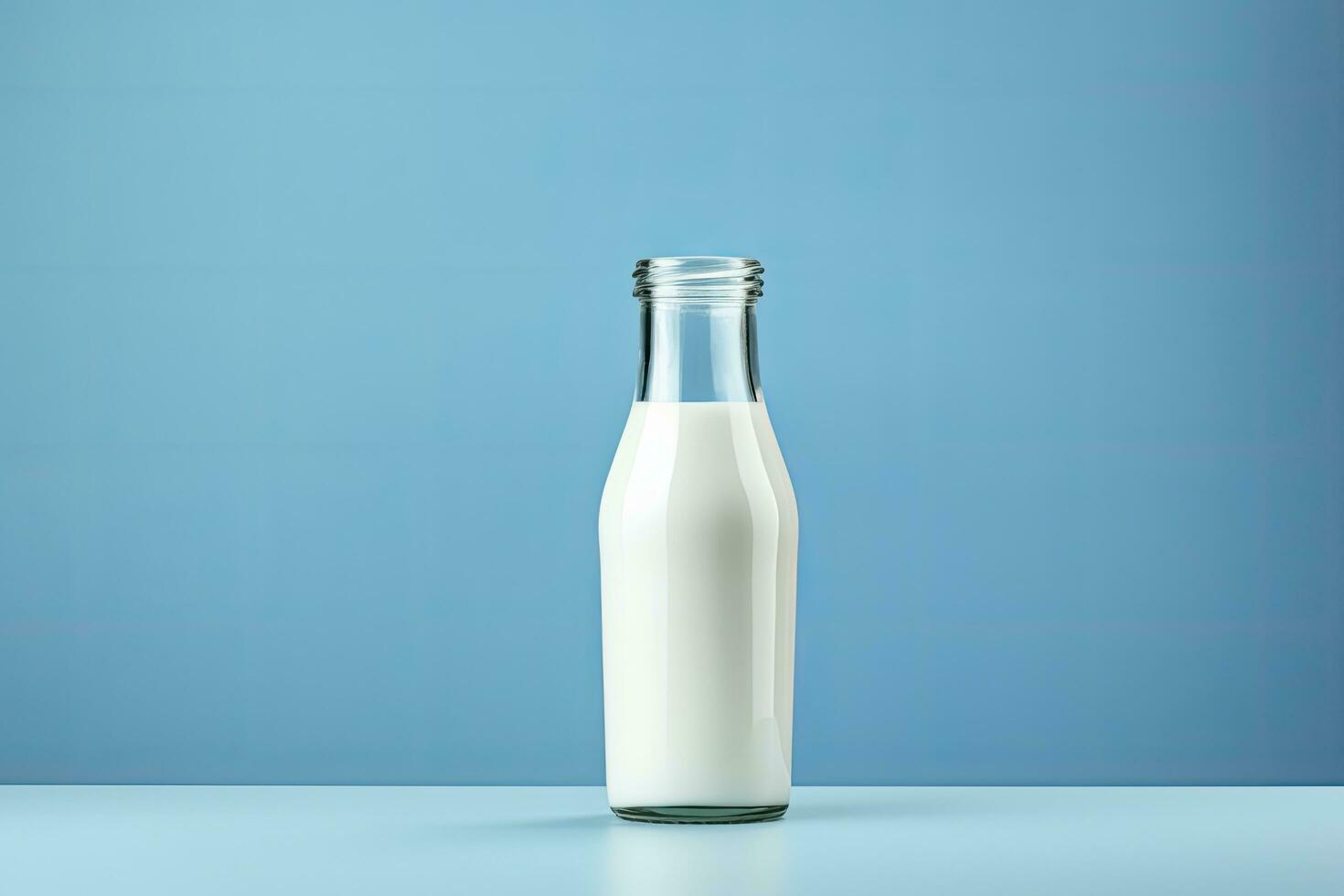 AI generated A glass bottle with full milk on blue background. AI Generated photo