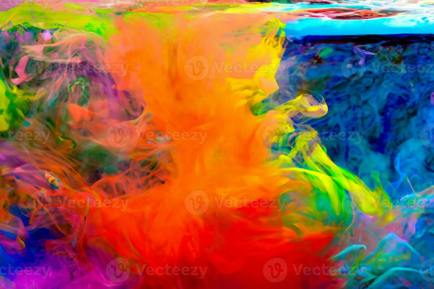 Colorful watercolor drops in the water with white flowers photo