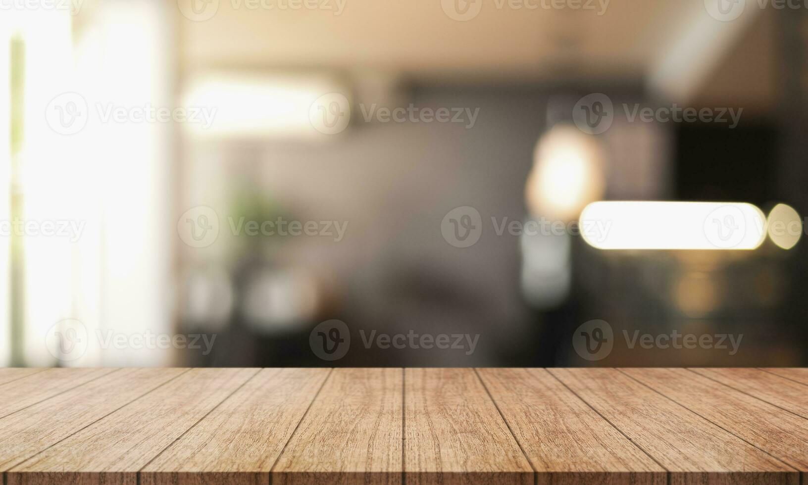 Empty wooden table top with lights bokeh on blur restaurant background. photo