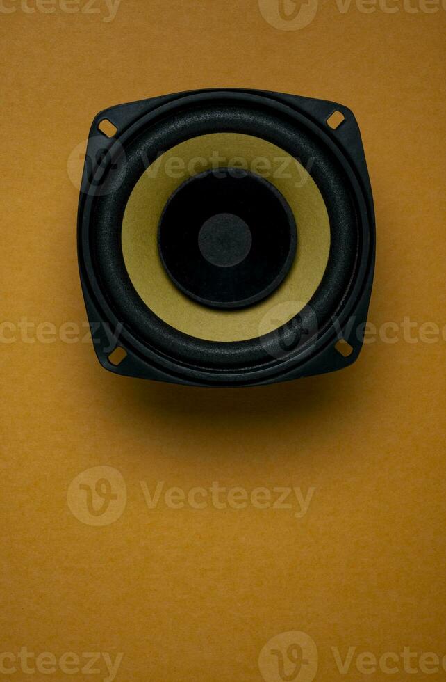 Audio speaker isolated on yellow background, Music system background photo