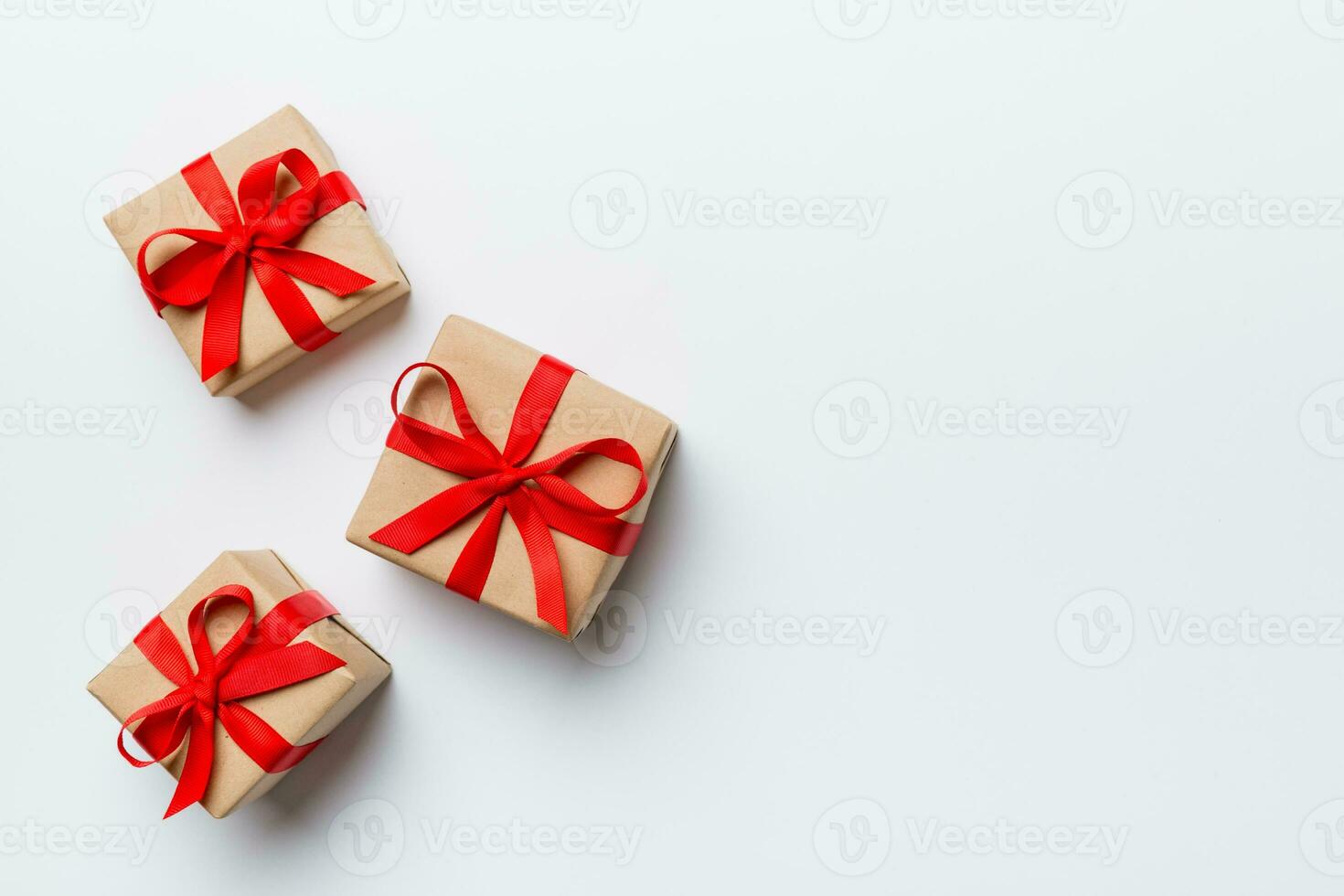 Valentine day composition red gift box with bow and heart. Christmas present. View from above. Space for text. Holday greeting card photo
