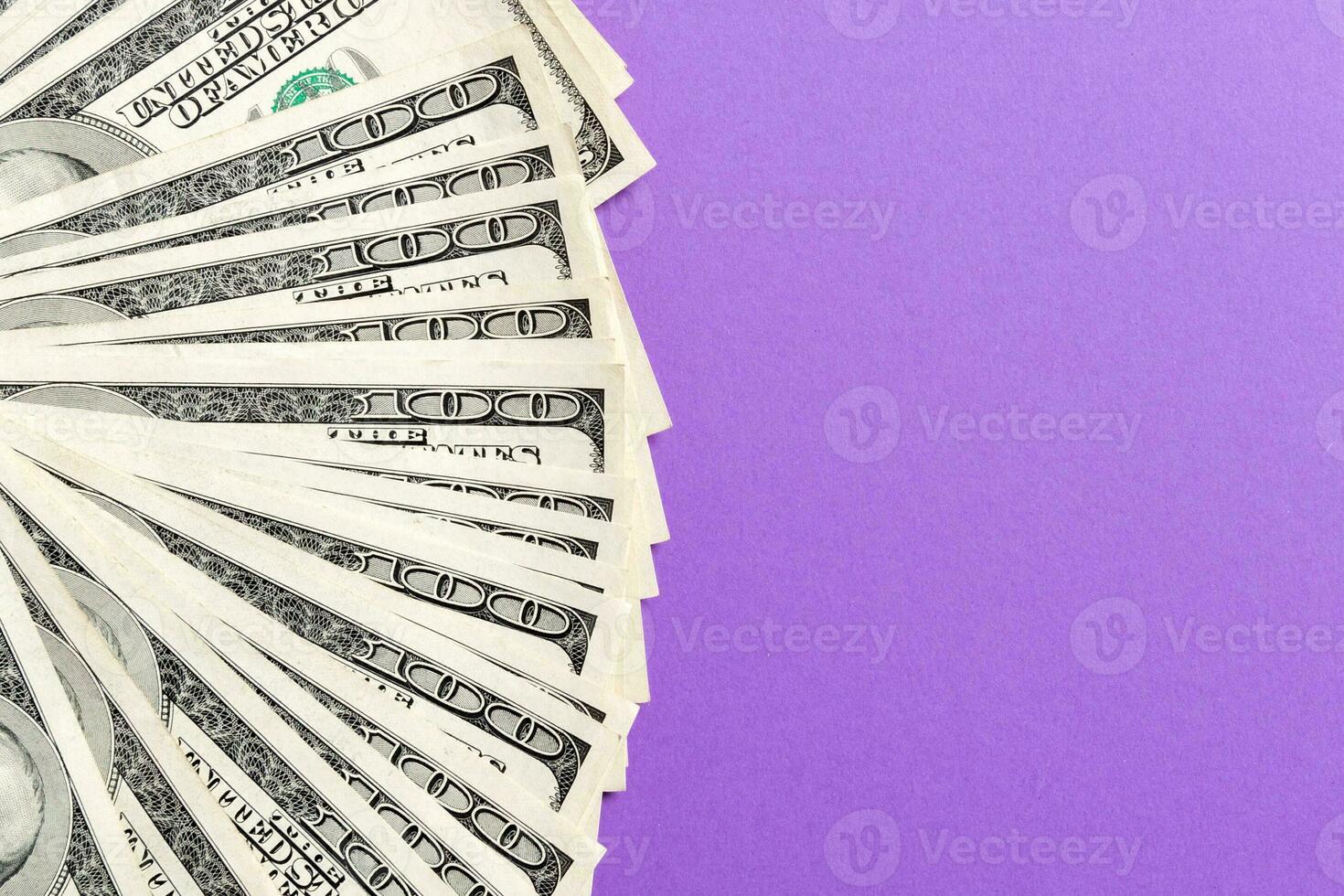 US Dollar Untidy fan of various US dollar bills Top view of business concept on colored background photo