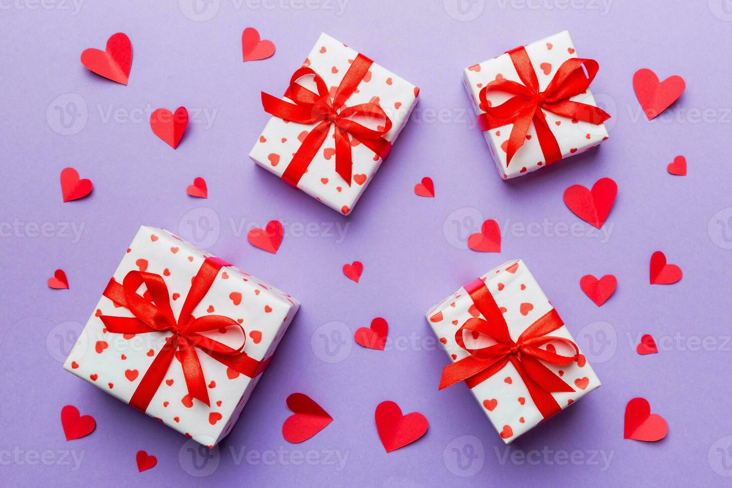 Valentine day composition red  gift box with bow and heart. Christmas present. View from above. Holday greeting card photo