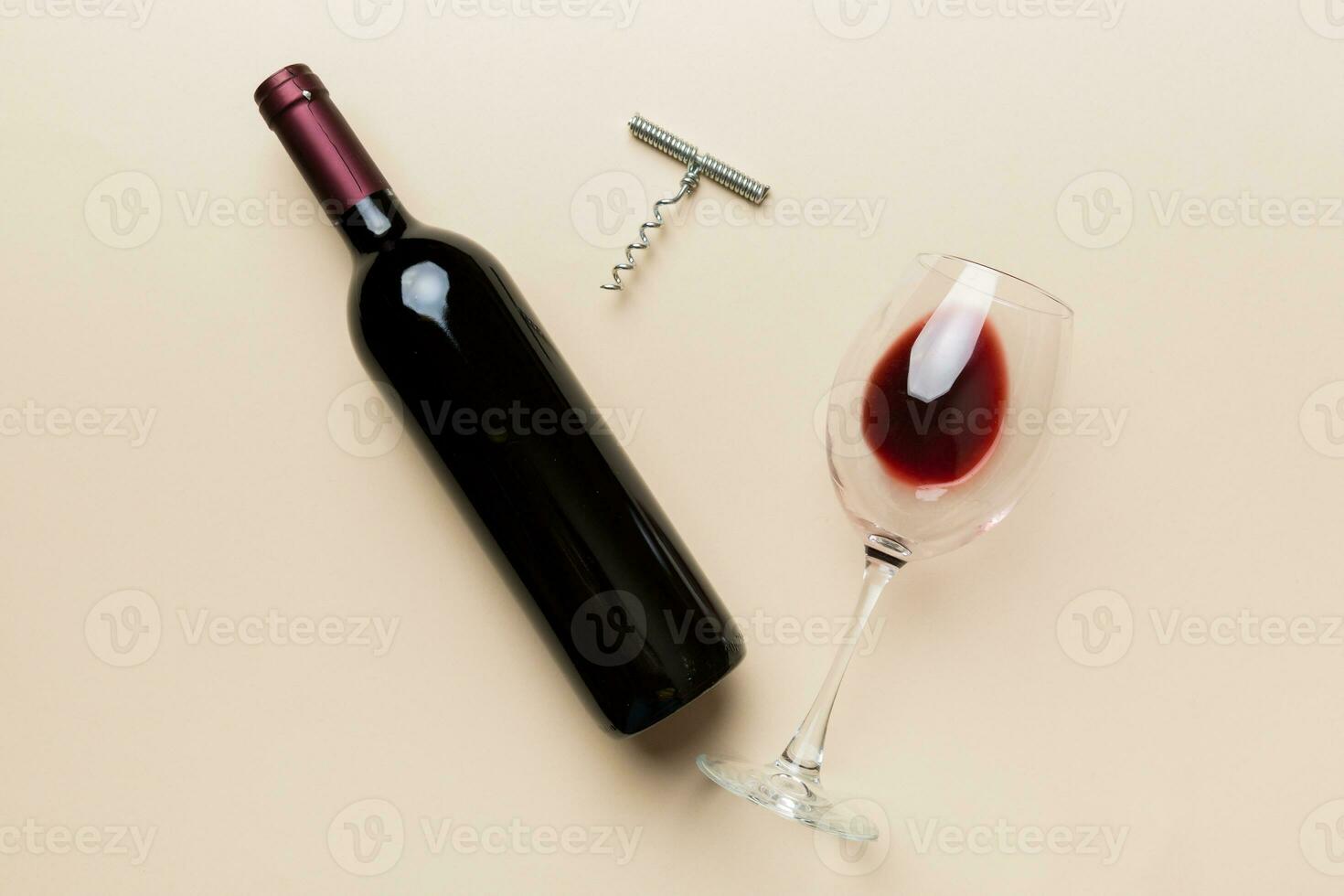 Flat lay composition with corkscrew, bottle of wine and elegant glass on colored table. Flat lay, top view wth copy space photo