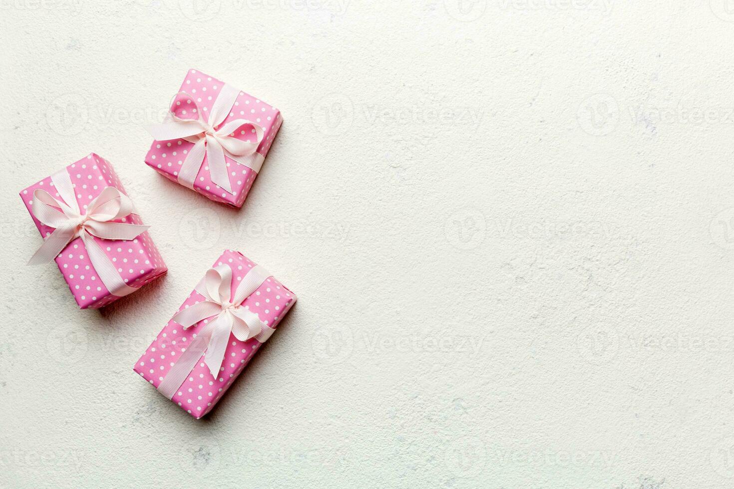 Valentine day composition red  gift box with bow and heart. Christmas present. View from above. Space for text. Holday greeting card photo
