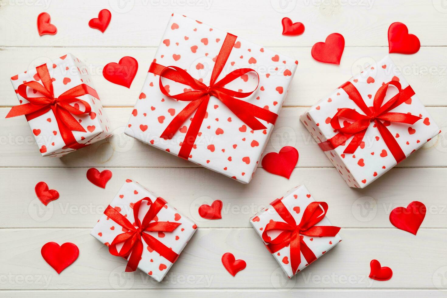 Valentine day composition red  gift box with bow and heart. Christmas present. View from above. Holday greeting card photo