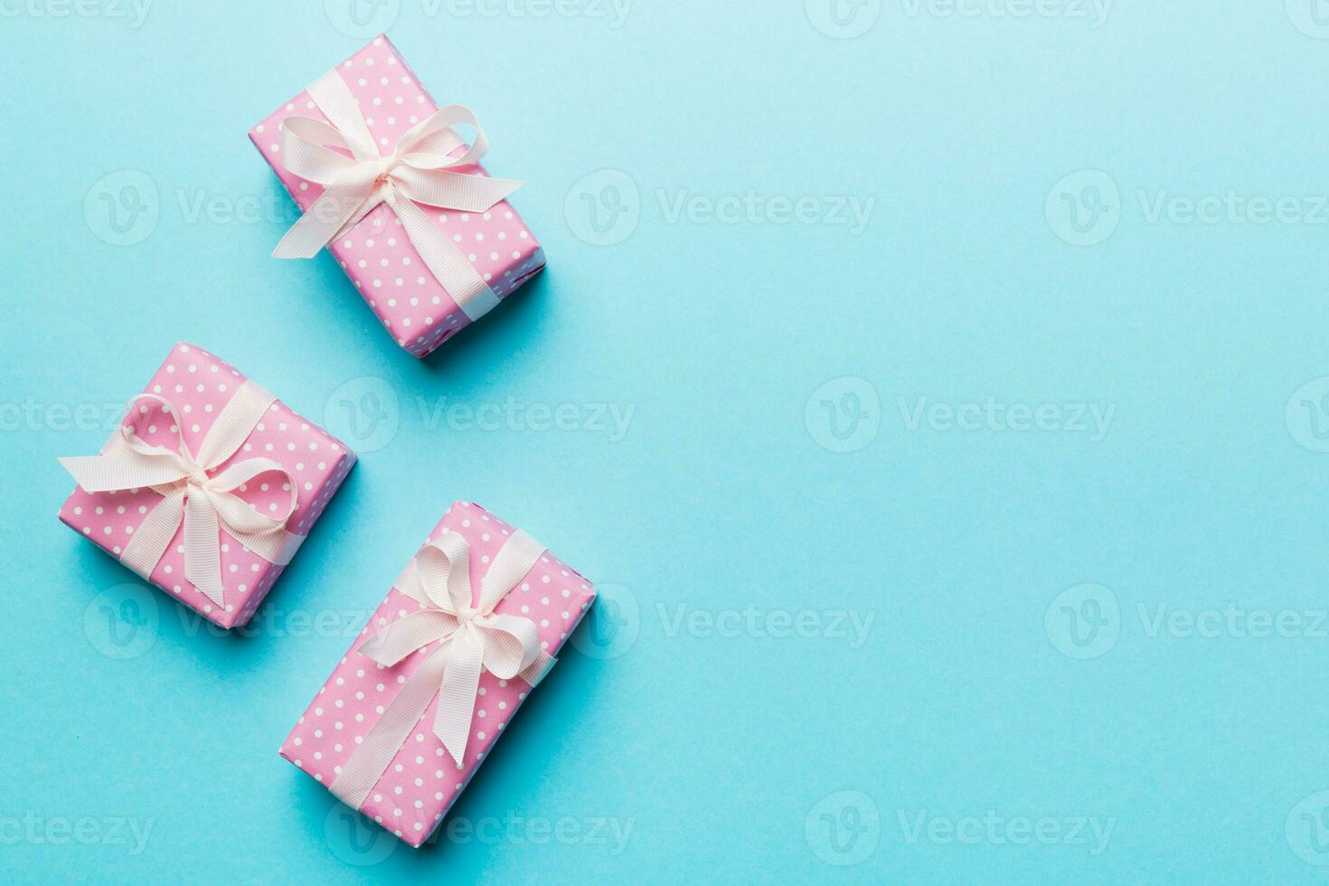 Valentine day composition red  gift box with bow and heart. Christmas present. View from above. Space for text. Holday greeting card photo