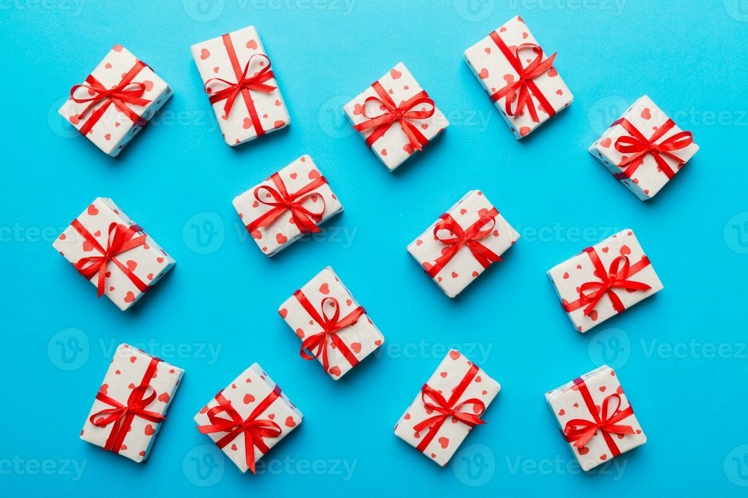 Valentine day composition red  gift box with bow and heart. Christmas present. View from above. Holday greeting card photo