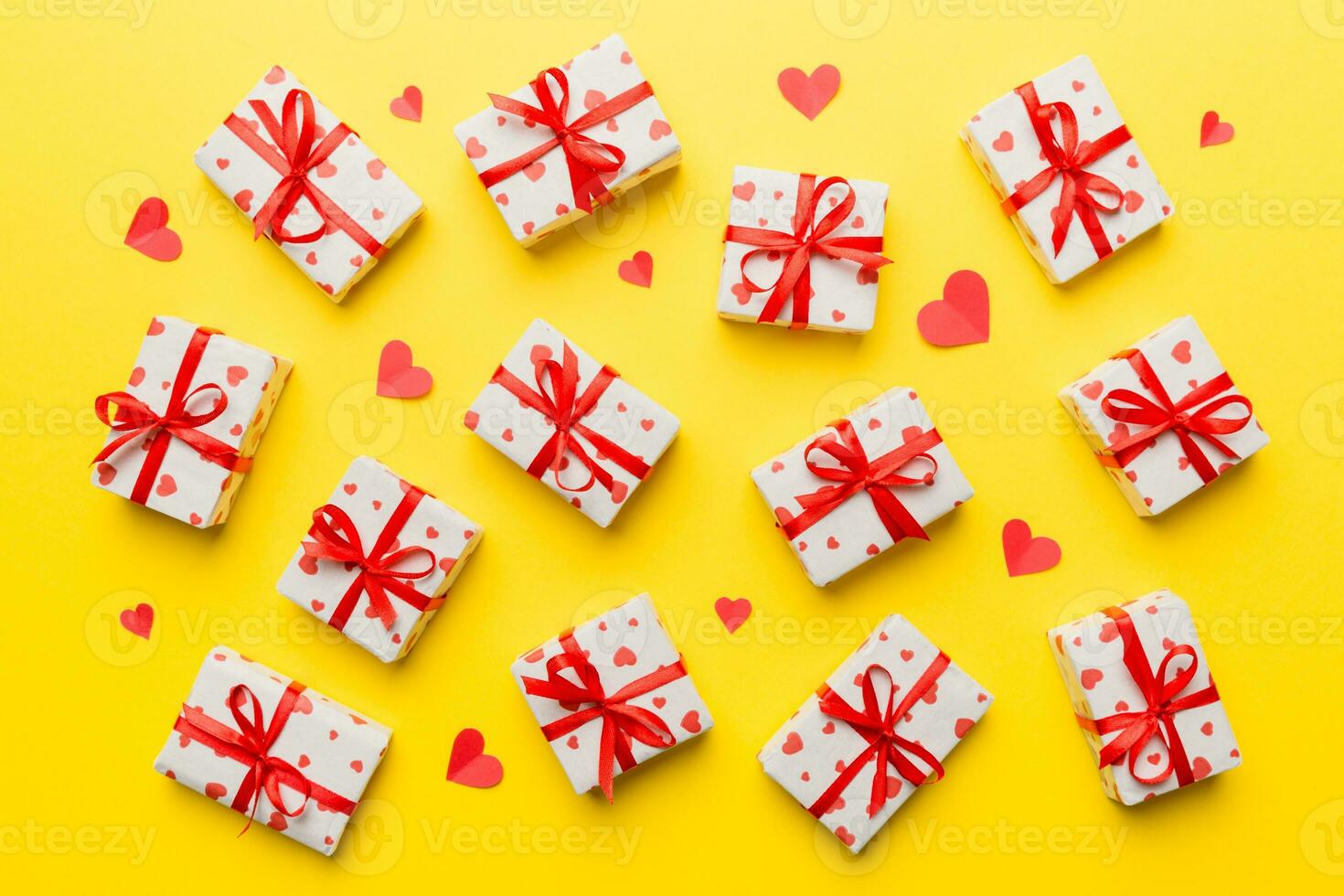 Valentine day composition red  gift box with bow and heart. Christmas present. View from above. Holday greeting card photo