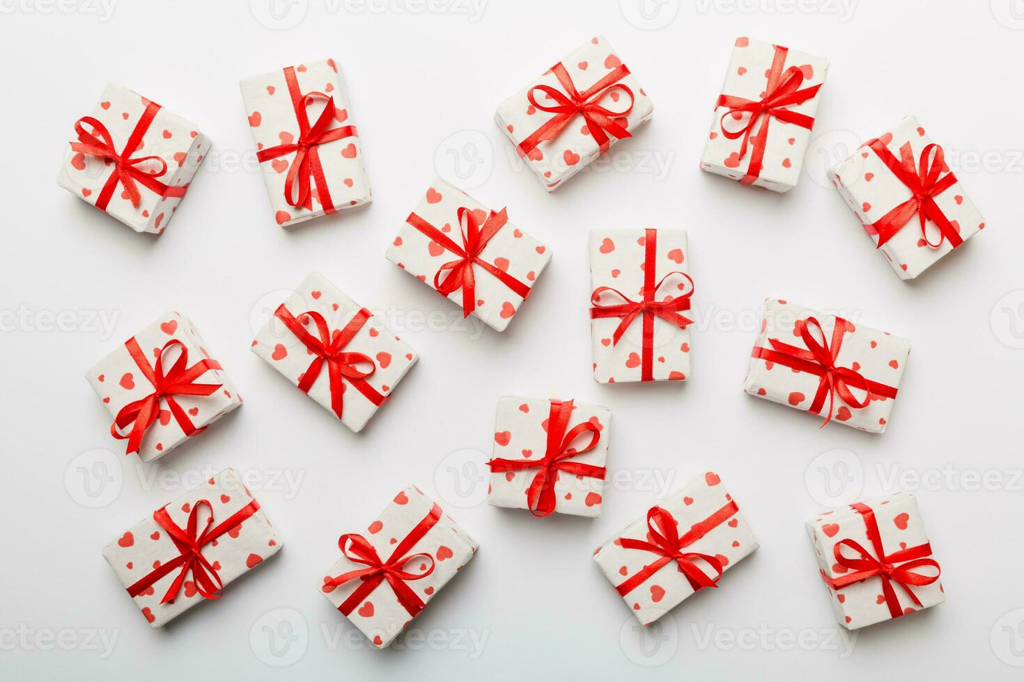 Valentine day composition red  gift box with bow and heart. Christmas present. View from above. Holday greeting card photo