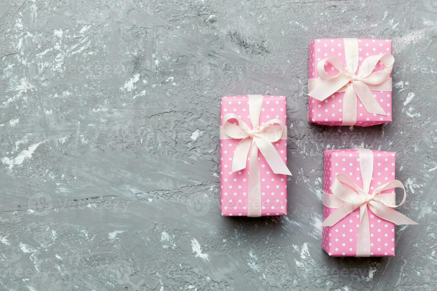 Valentine day composition red gift box with bow and heart. Christmas present. View from above. Space for text. Holday greeting card photo