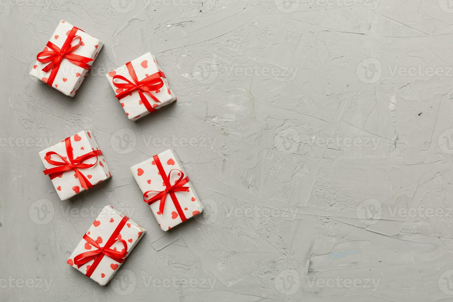 Valentine day composition red  gift box with bow and heart. Christmas present. View from above. Space for text. Holday greeting card photo
