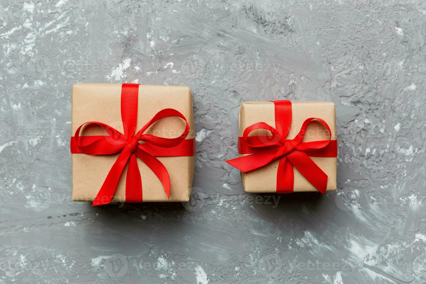 Valentine day composition red  gift box with bow and heart. Christmas present. View from above. Holday greeting card photo