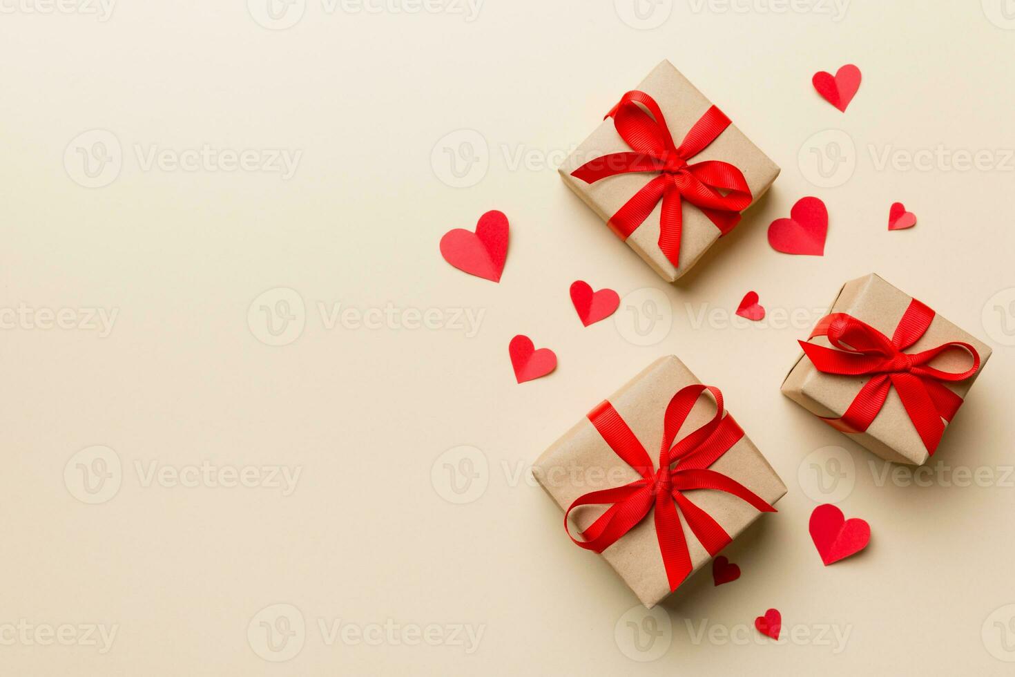 Valentine day composition red  gift box with bow and heart. Christmas present. View from above. Space for text. Holday greeting card photo
