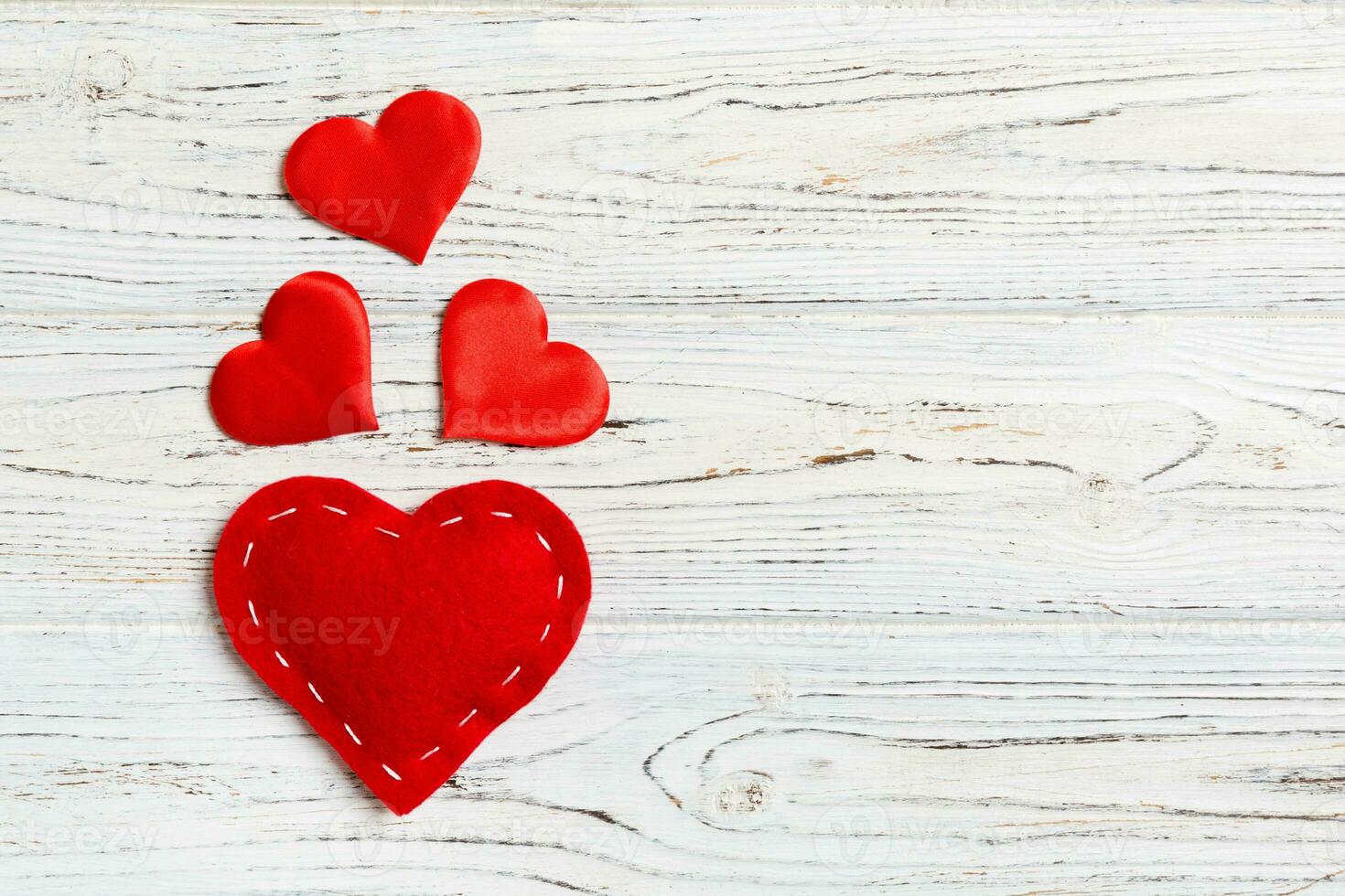 Top view of red hearts on wooden background with copy space. Romantic concept. Valentine's day concept photo