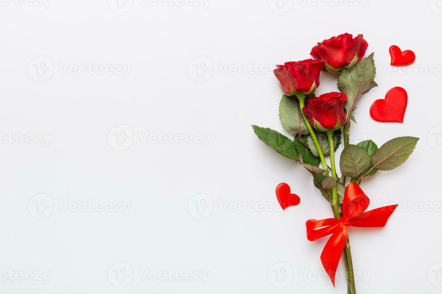 Valentine day composition with rose flower and red heart on table. Top view, flat lay, copy space Holiday concept photo