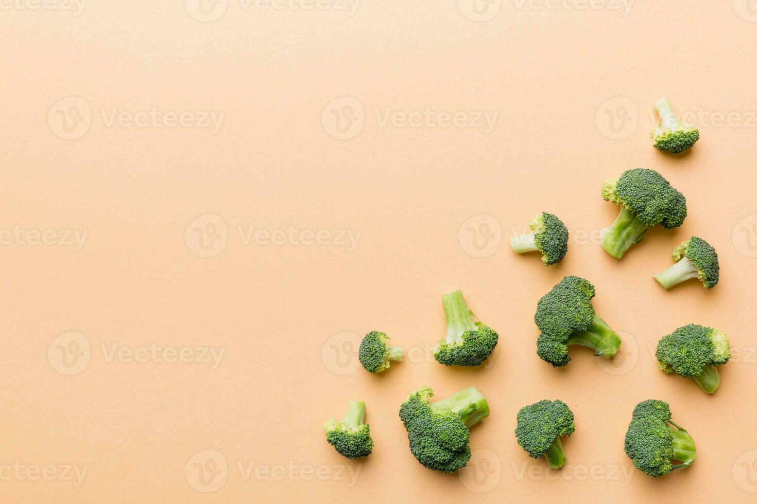 Top view fresh green broccoli vegetable on Colored background. Broccoli cabbage head Healthy or vegetarian food concept. Flat lay. Copy space photo