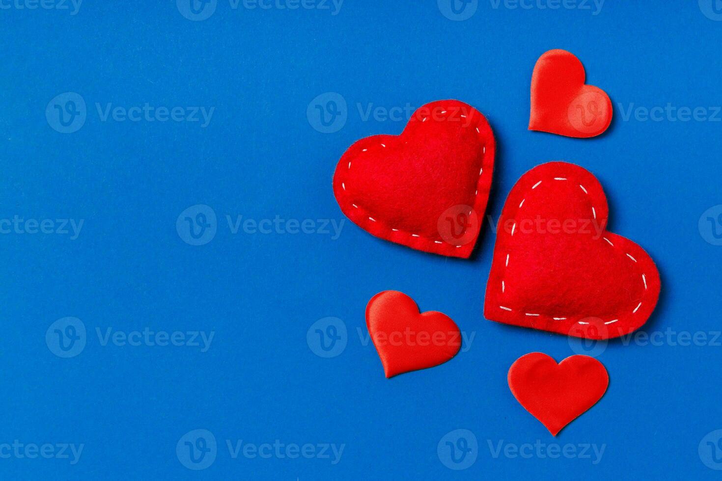 Top view composition of red hearts on colorful background. Romantic relationship concept. Valentaine's Day photo