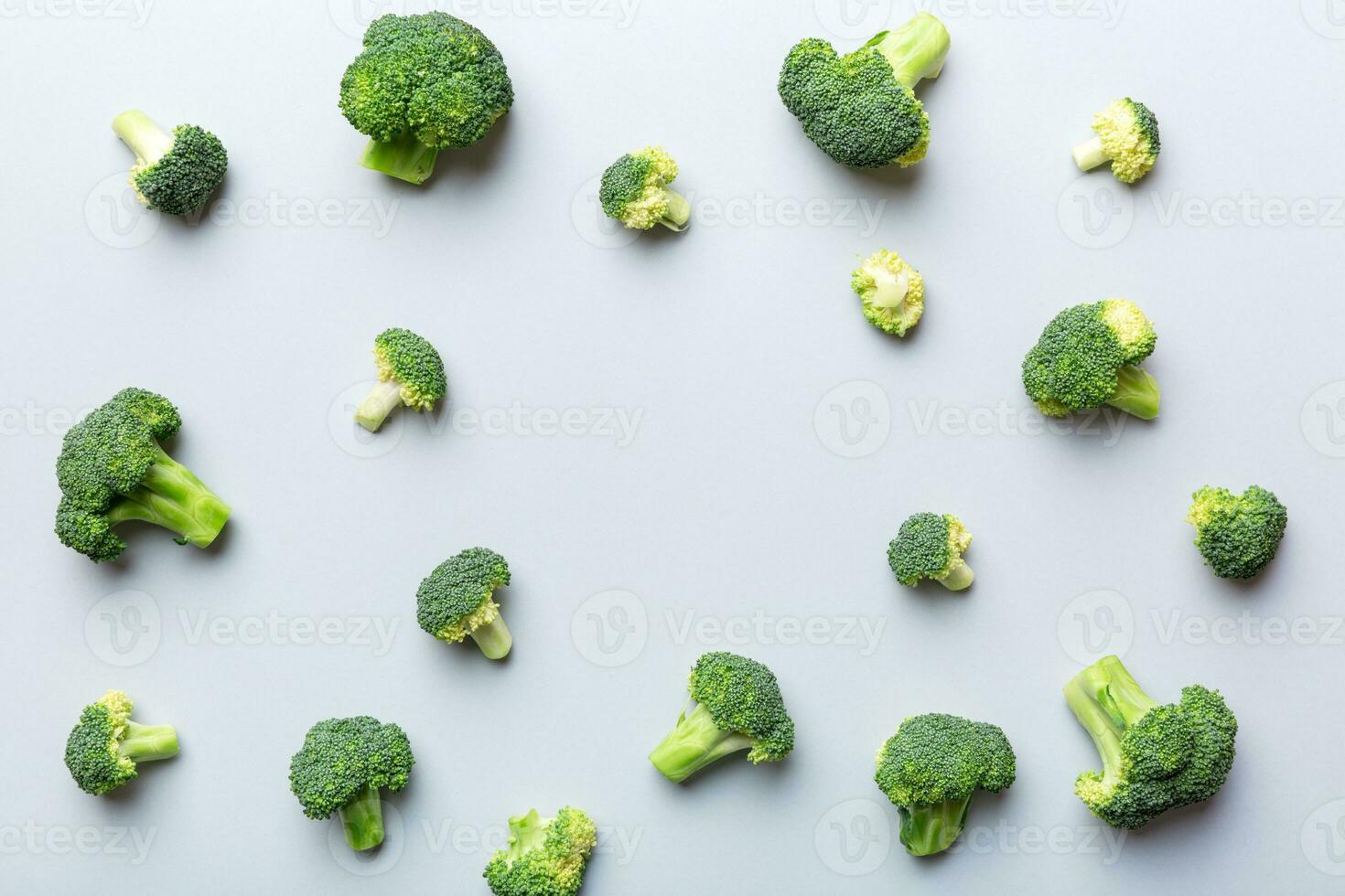 green fresh broccoli background close up on colored table. Vegetables for diet and healthy eating. Organic food photo