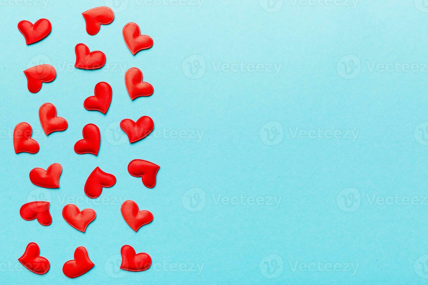 Valentine day background with red hearts, top view with copy space photo