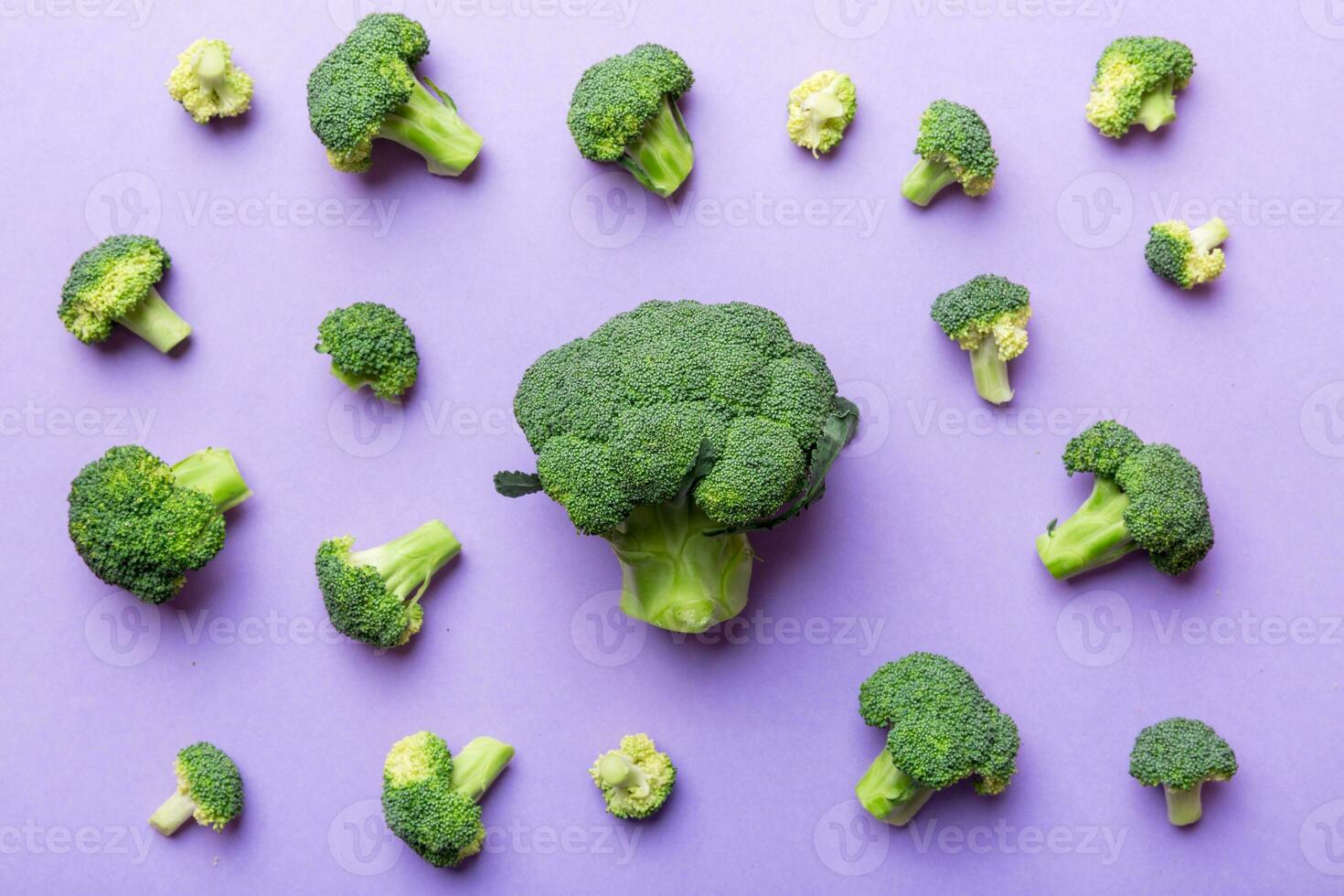 green fresh broccoli background close up on colored table. Vegetables for diet and healthy eating. Organic food photo