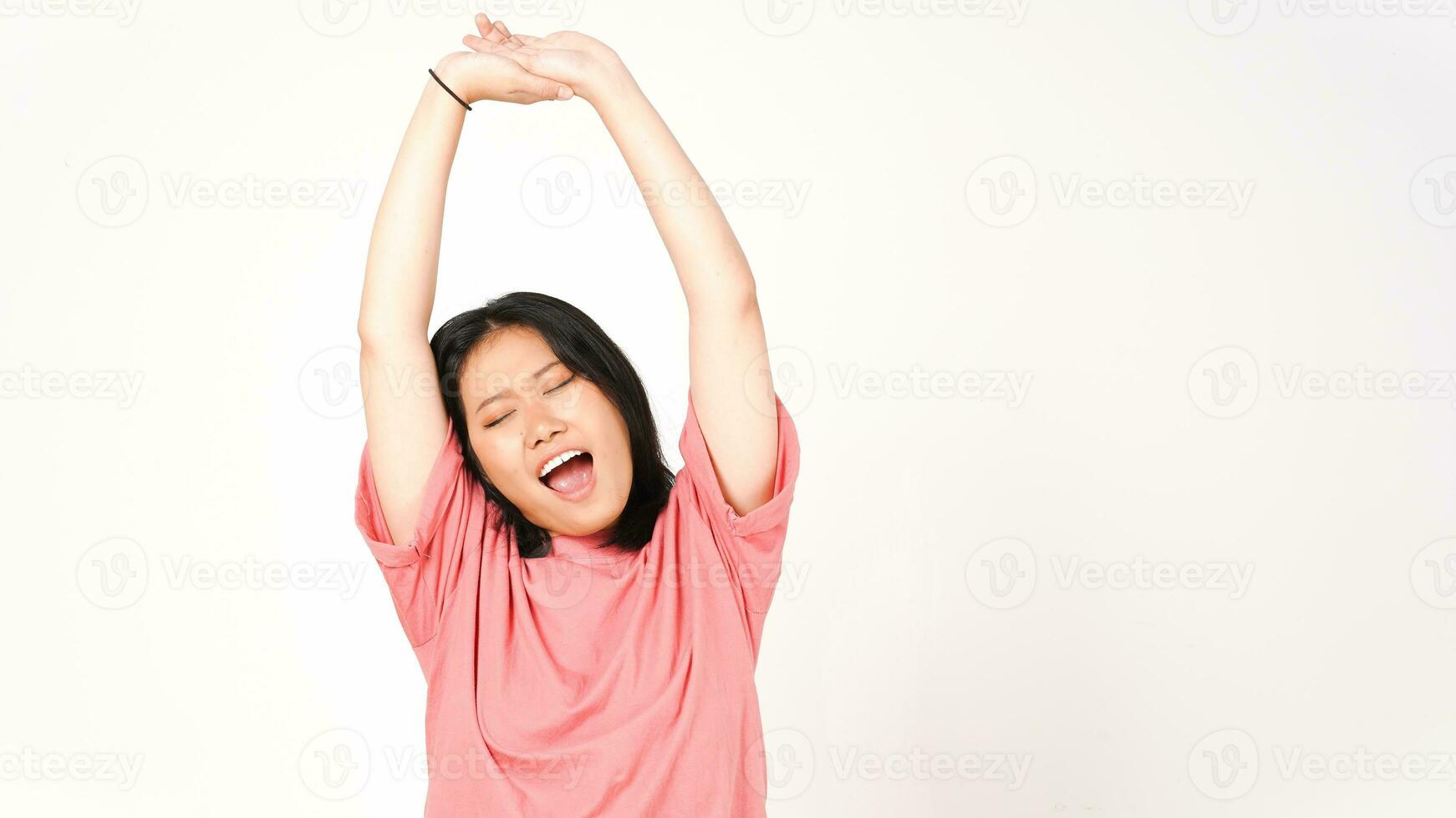 Young Asian woman in pink t-shirt doing wake up stretch isolated on white background photo