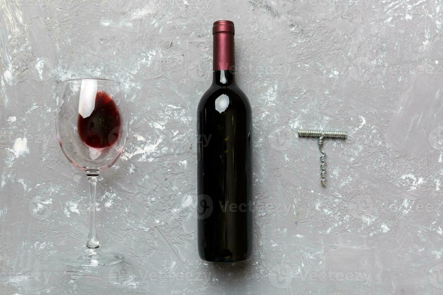 Flat lay composition with corkscrew, bottle of wine and elegant glass on colored table. Flat lay, top view wth copy space photo