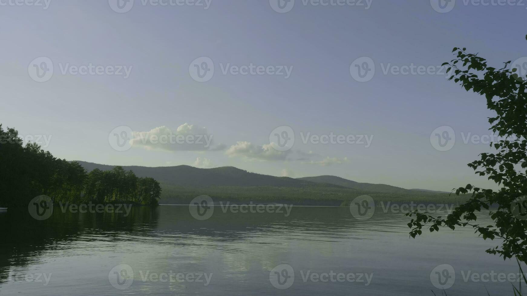 Summer landscape with river, cloudy sky, forest and sun timelapse. summer landscape with river and blue sky time lapse. Amazing clouds on the lake coast photo