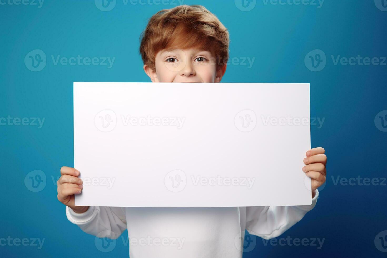 AI generated Little boy holding a blank white sheet of paper photo