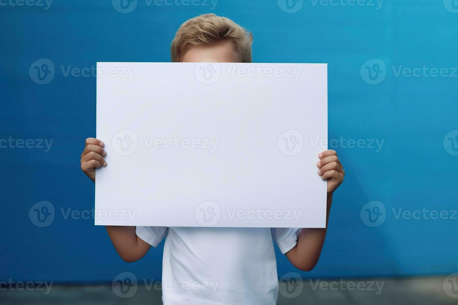 AI generated Little boy holding a blank white sheet of paper photo