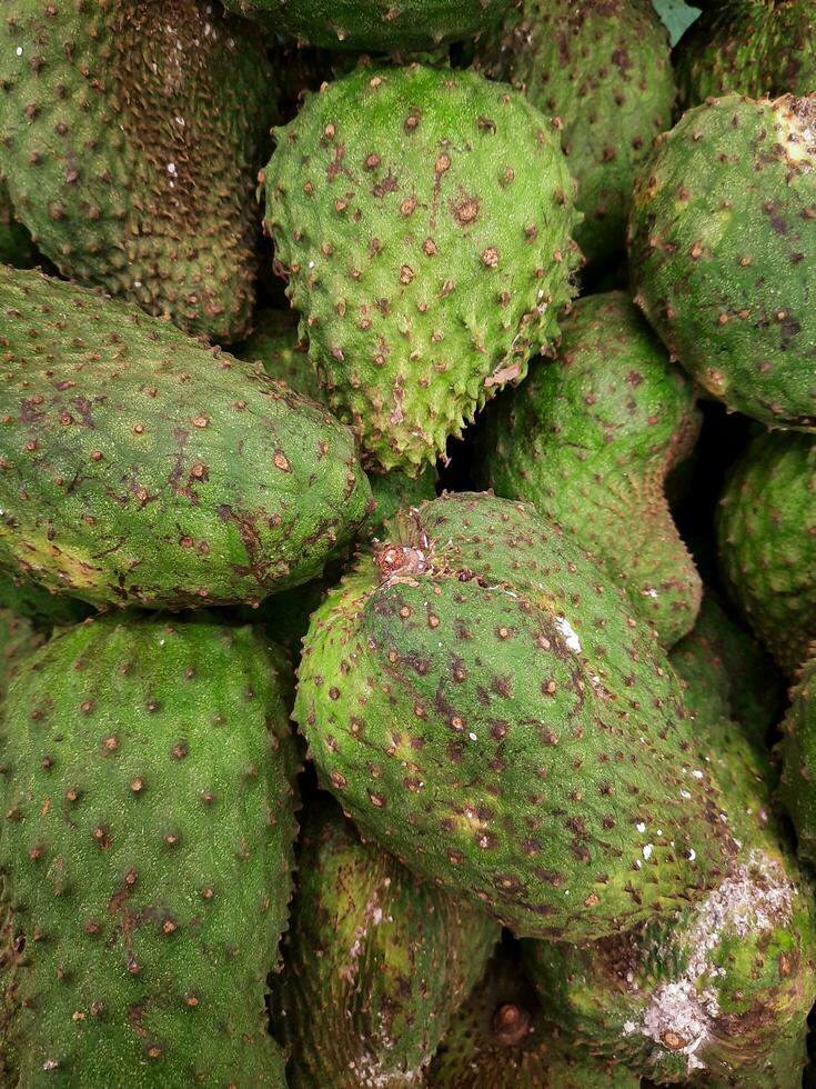 Soursop fruit sold in the market photo