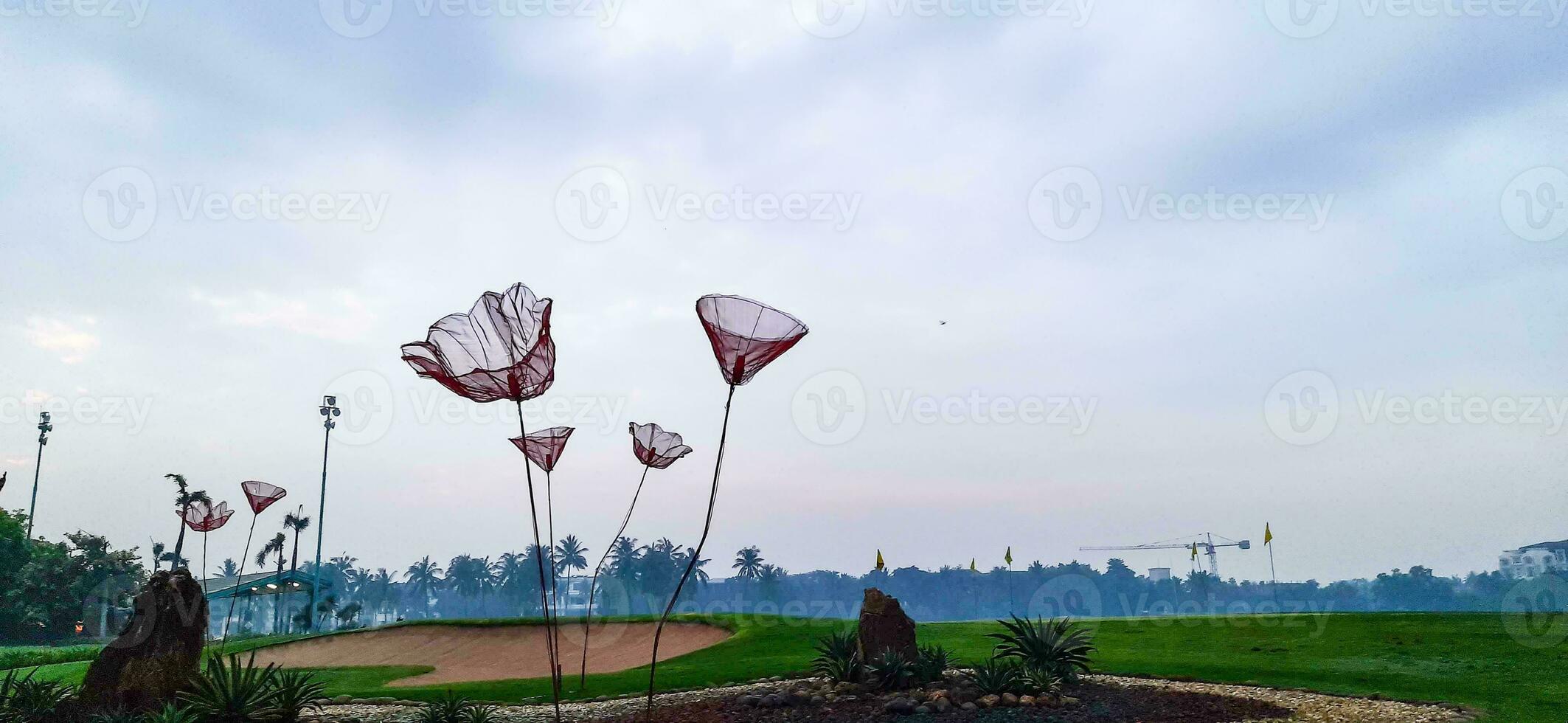 This is the front garden of the golf course I once visited. This golf course has a marine theme filled with coconut trees. photo