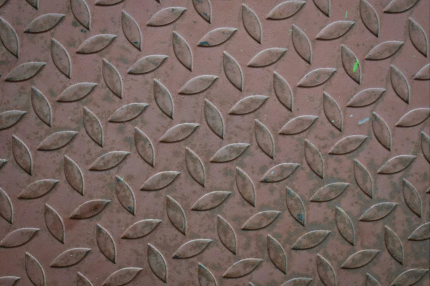 The iron water channel cover has a textured pattern. This iron can be found at several points. photo
