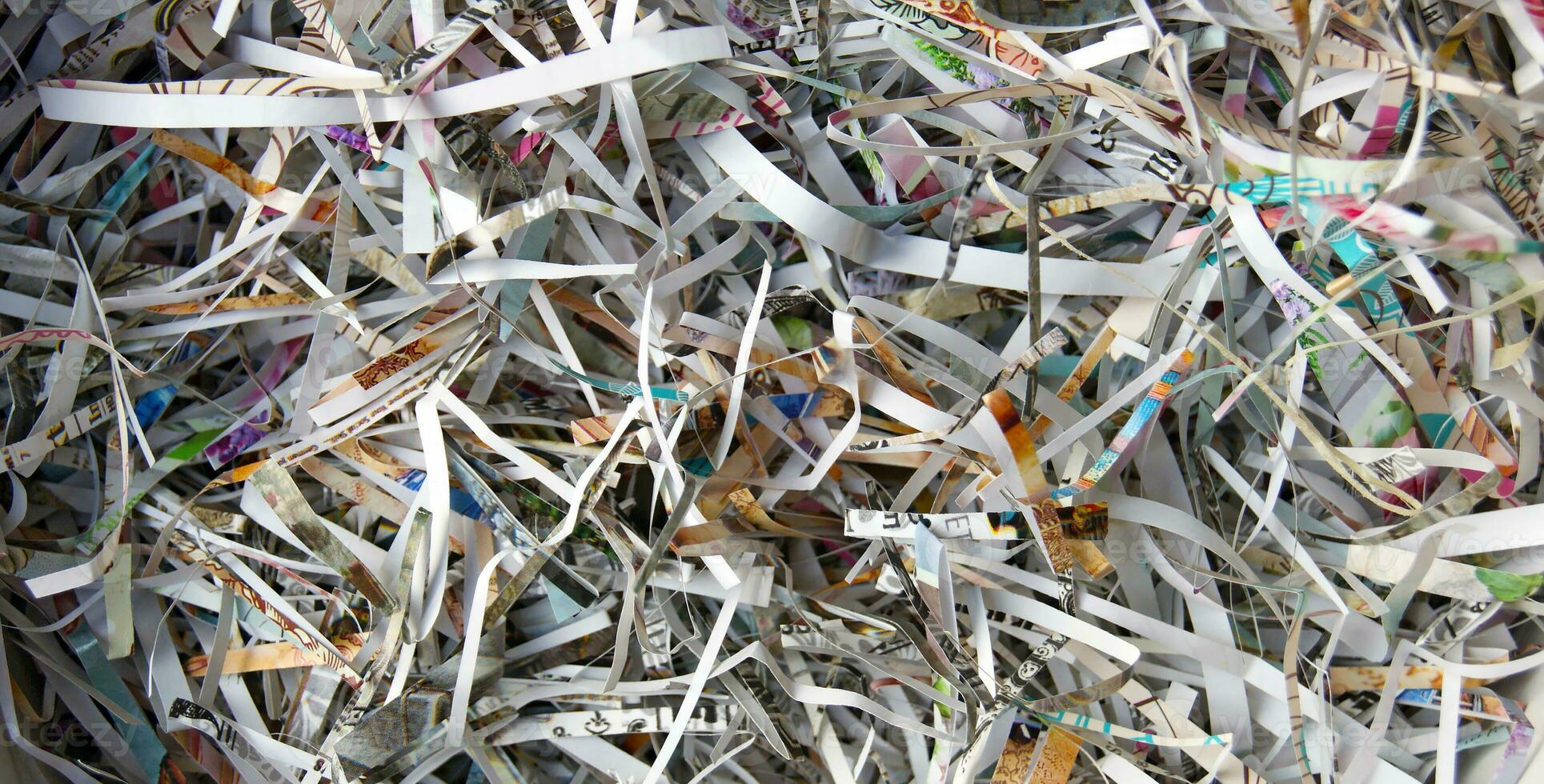 CloseUp shredded paper texture and reuse paper scrap background. photo