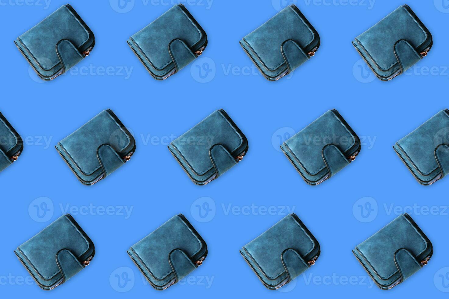 Cloned blue female wallet isolated on a blue background. photo