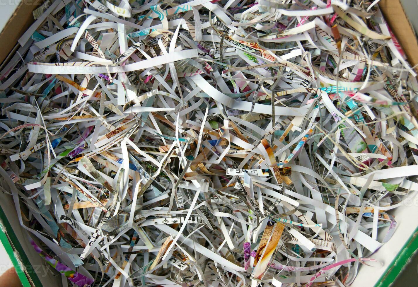 CloseUp shredded paper texture and reuse paper scrap background. photo